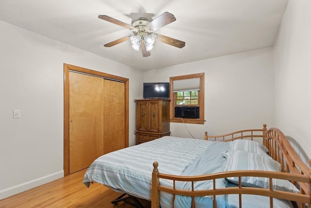 10 Powderhouse Cir, Wilmington, MA 01887 - bedroom with baseboards, light wood-style flooring, a closet, cooling unit, and a ceiling fan