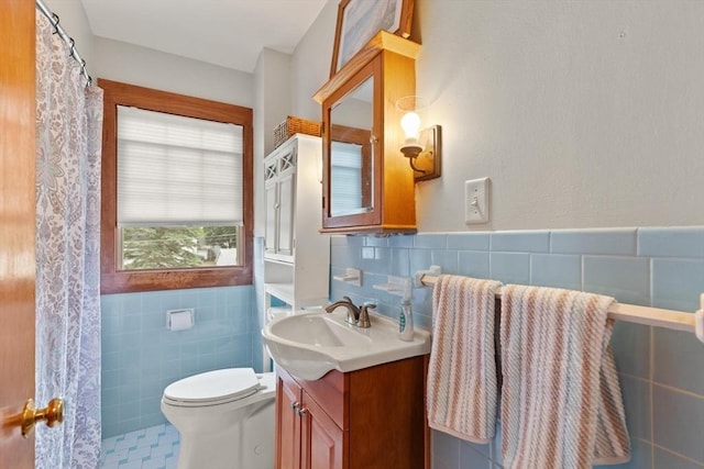 10 Powderhouse Cir, Wilmington, MA 01887 - full bath with tile walls, vanity, toilet, and wainscoting