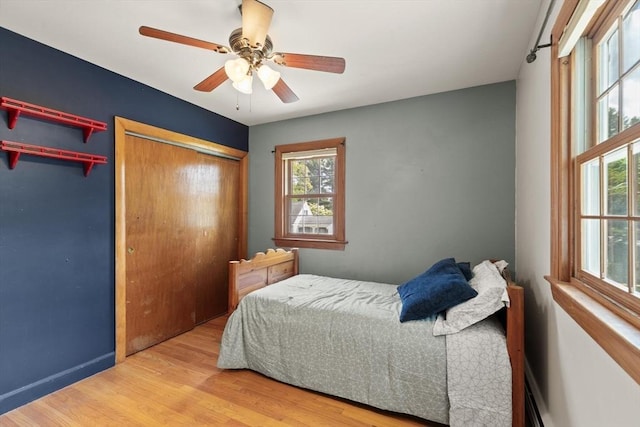 10 Powderhouse Cir, Wilmington, MA 01887 - bedroom with multiple windows, wood finished floors, baseboards, and ceiling fan