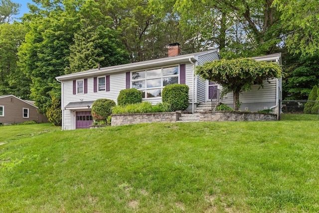 10 Powderhouse Cir, Wilmington, MA 01887 - view of front facade with a chimney and a garage