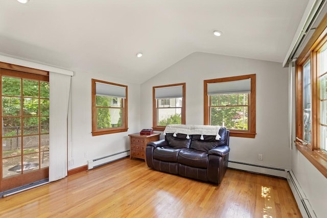 10 Powderhouse Cir, Wilmington, MA 01887 - living room with baseboard heating, light wood-type flooring, and lofted ceiling