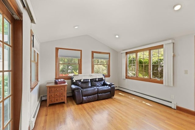 10 Powderhouse Cir, Wilmington, MA 01887 - living area with a baseboard heating unit, light wood-style flooring, healthy amount of natural light, vaulted ceiling, and recessed lighting