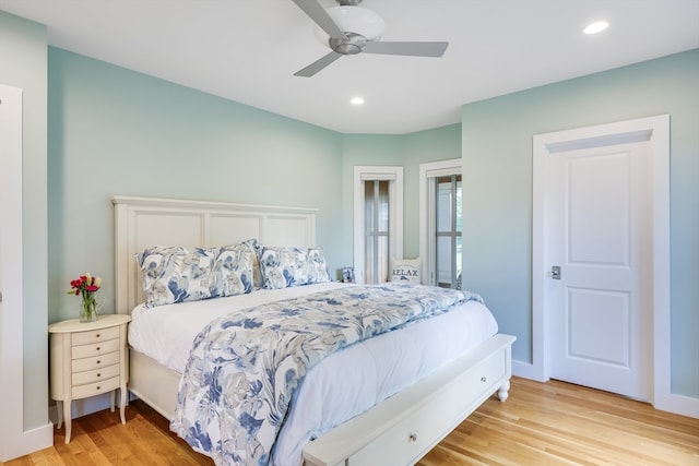 bedroom with light wood-type flooring and ceiling fan