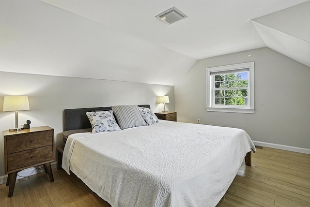 7 Vermont Ave, Natick, MA 01760 - bedroom with hardwood / wood-style floors and lofted ceiling