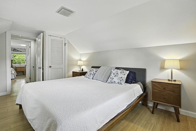 7 Vermont Ave, Natick, MA 01760 - bedroom with wood finished floors, vaulted ceiling, and a closet