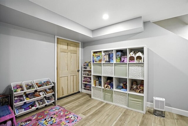 7 Vermont Ave, Natick, MA 01760 - recreation room featuring wood finished floors and baseboards