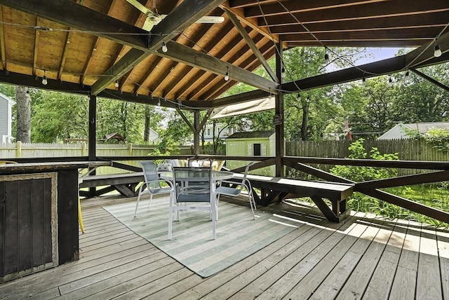 7 Vermont Ave, Natick, MA 01760 - wooden terrace with a storage unit, a fenced backyard, outdoor dining space, and view of wooded area