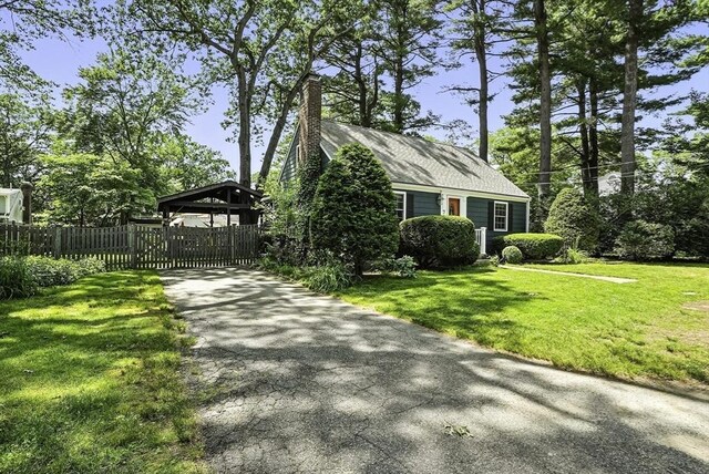 7 Vermont Ave, Natick, MA 01760 - view of front facade featuring a chimney and asphalt driveway