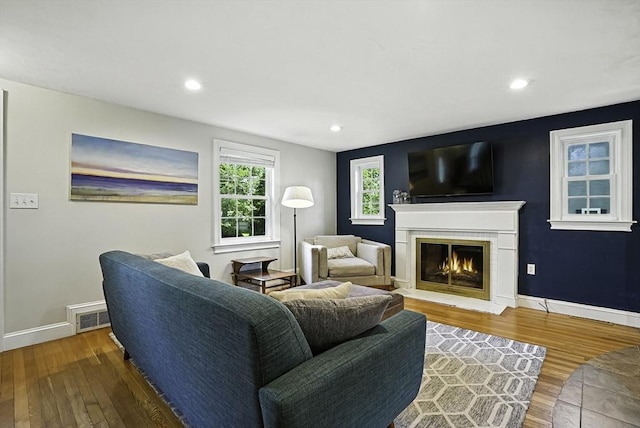 7 Vermont Ave, Natick, MA 01760 - living room featuring hardwood / wood-style floors, a glass covered fireplace, and recessed lighting