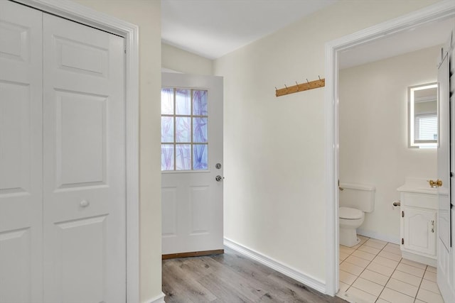 17-1 Parkers Ln Unit 1, Waltham, MA 02453 - doorway to outside with light wood-type flooring and baseboards