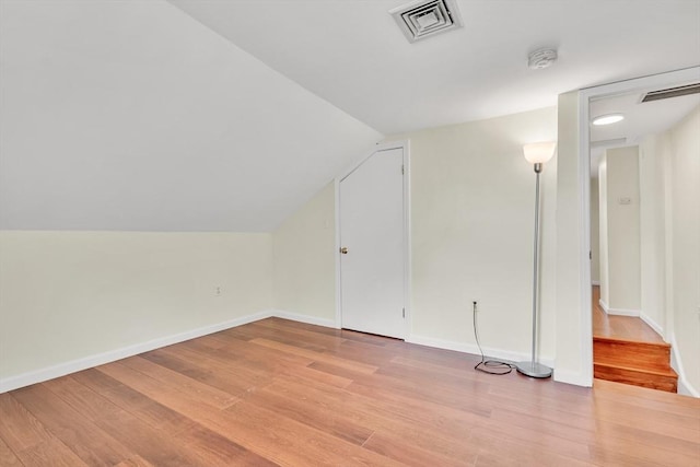 17-1 Parkers Ln Unit 1, Waltham, MA 02453 - additional living space with light wood-type flooring, lofted ceiling, and baseboards