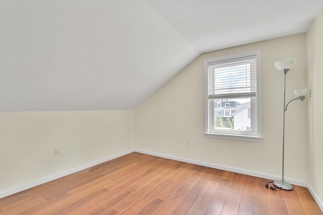 17-1 Parkers Ln Unit 1, Waltham, MA 02453 - additional living space with lofted ceiling, baseboards, and light wood-style flooring