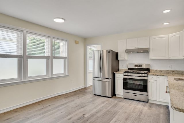 17-1 Parkers Ln Unit 1, Waltham, MA 02453 - kitchen with appliances with stainless steel finishes, under cabinet range hood, light wood-style floors, white cabinets, and recessed lighting