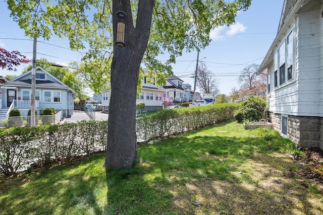 view of yard with fence and a residential view