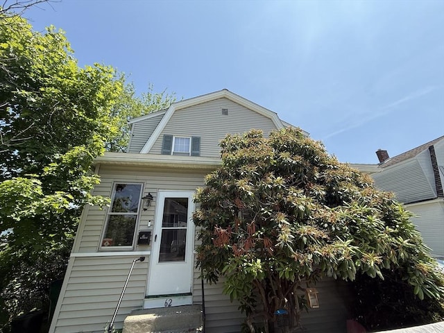 62 Marion St, Fitchburg, MA 01420 - dutch colonial featuring a gambrel roof and entry steps