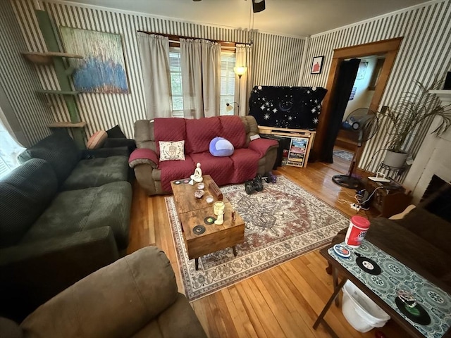 62 Marion St, Fitchburg, MA 01420 - living area featuring wallpapered walls, wood finished floors, and ceiling fan