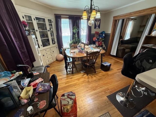62 Marion St, Fitchburg, MA 01420 - dining space featuring light wood-type flooring, ornamental molding, and a chandelier