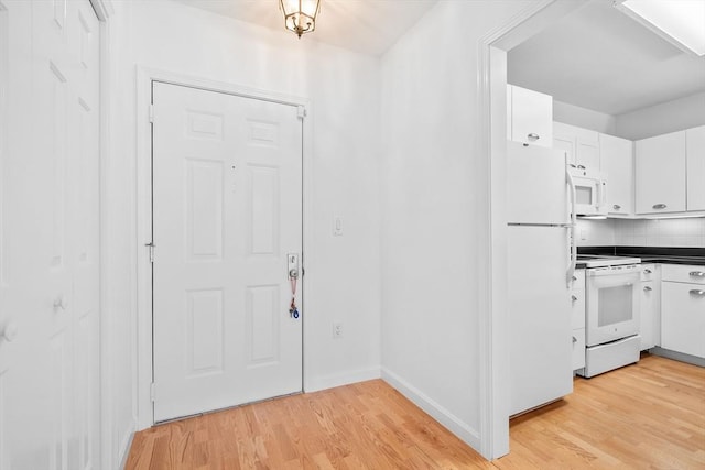 entryway with light hardwood / wood-style flooring