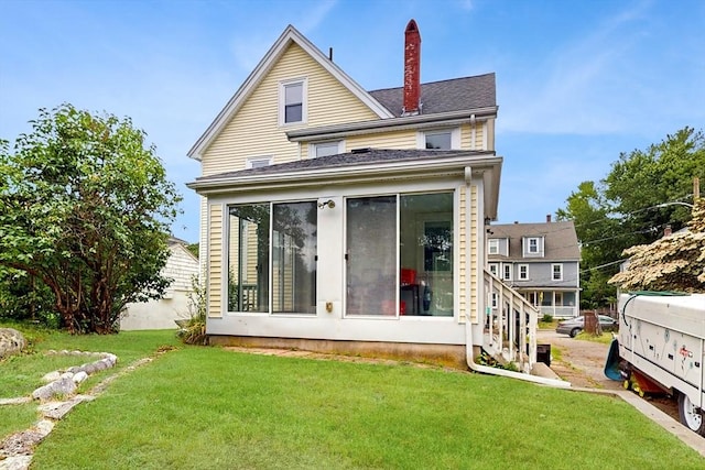 11 Quincy Ave, Norwood, MA 02062 - back of house with a sunroom, a lawn, and a chimney