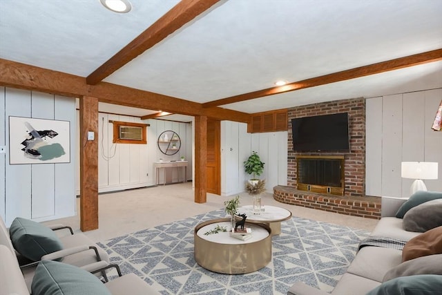 carpeted living area with beamed ceiling, wooden walls, a fireplace, and an AC wall unit