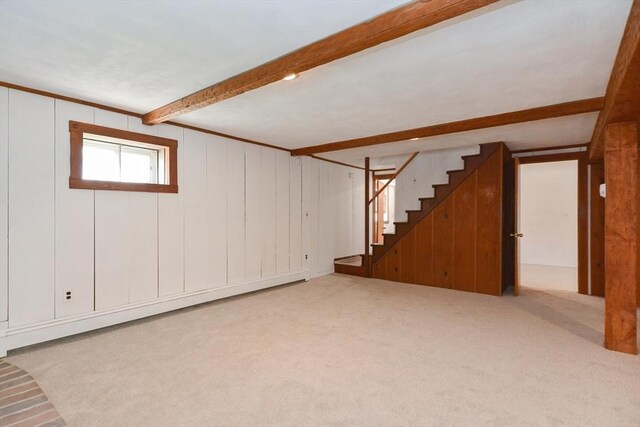 basement featuring carpet and stairway