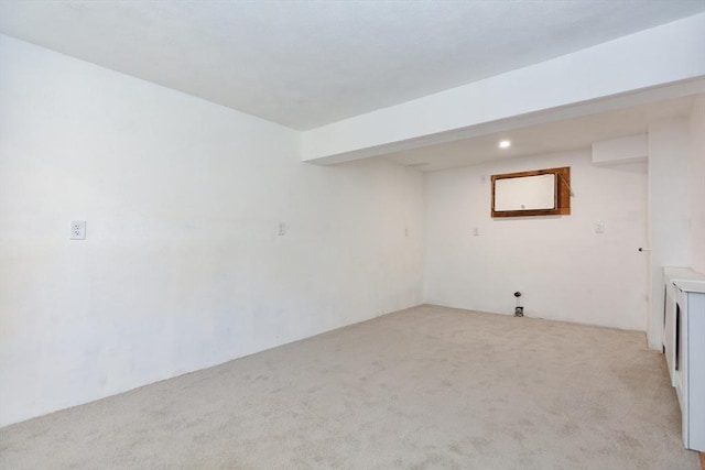 finished basement featuring light carpet and recessed lighting