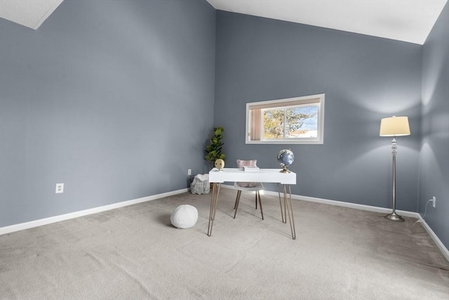 office featuring vaulted ceiling and carpet