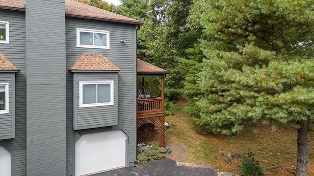 view of side of home with a garage