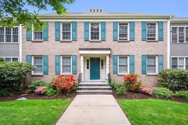 501 Lexington St Unit 35, Waltham, MA 02452 - view of front of property featuring brick siding and a front yard