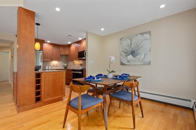 501 Lexington St Unit 35, Waltham, MA 02452 - dining area with light wood-style floors, a baseboard radiator, and recessed lighting