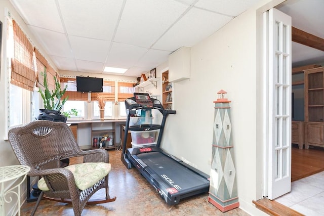 exercise area featuring a drop ceiling