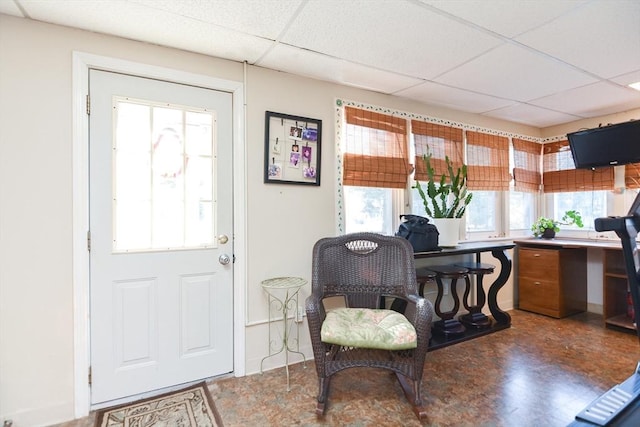 interior space featuring a paneled ceiling