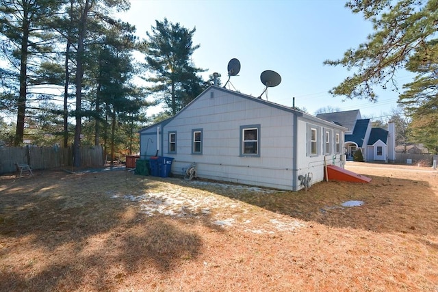 view of side of property with fence