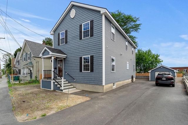 view of front of house with an outbuilding and a garage