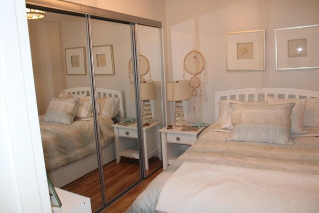 bedroom with a closet and wood finished floors
