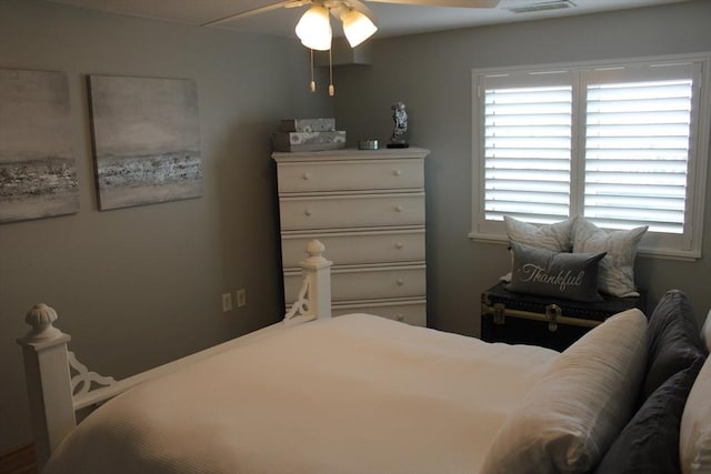 bedroom featuring visible vents and a ceiling fan
