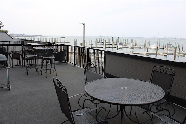 view of patio with a water view
