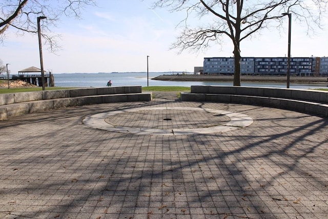 view of community with a water view