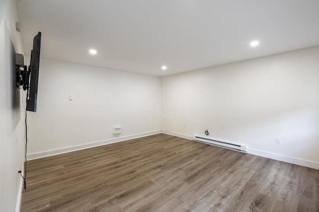53 Kalish Ave, Enfield, CT 06082 - unfurnished room with a baseboard radiator, wood finished floors, recessed lighting, and baseboards