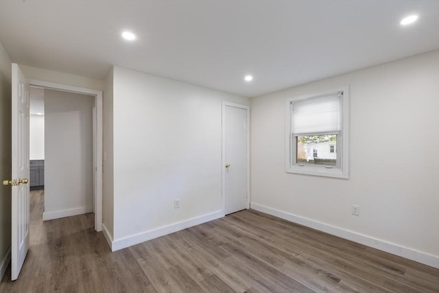 53 Kalish Ave, Enfield, CT 06082 - unfurnished bedroom featuring wood finished floors, baseboards, and recessed lighting
