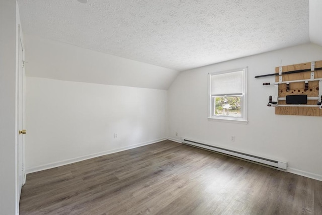 53 Kalish Ave, Enfield, CT 06082 - additional living space featuring a baseboard radiator, wood finished floors, lofted ceiling, a textured ceiling, and baseboards