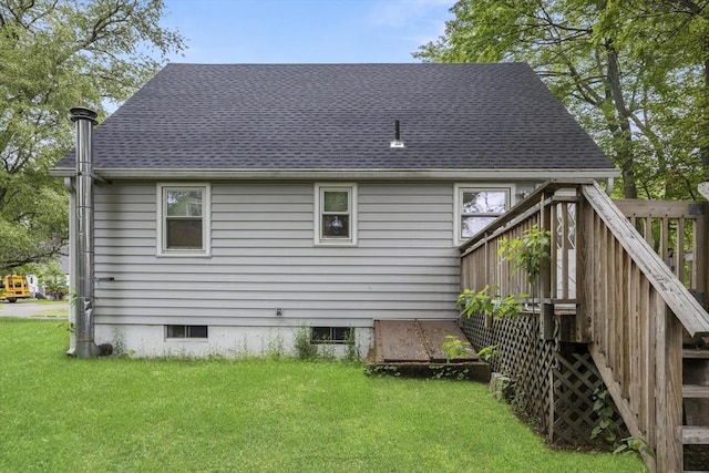 53 Kalish Ave, Enfield, CT 06082 - rear view of house featuring a yard, roof with shingles, and a wooden deck