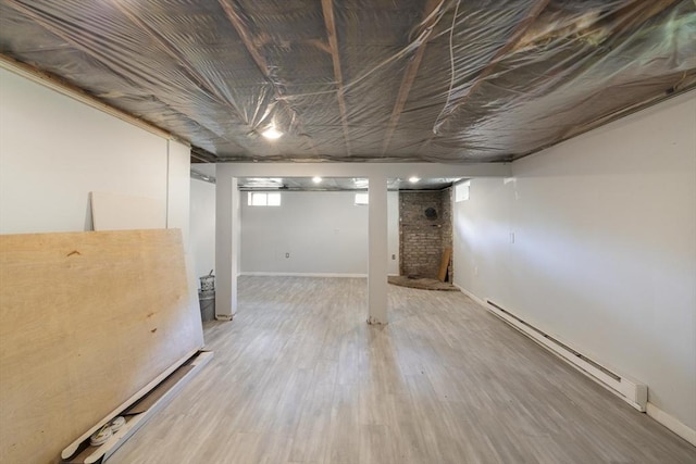 53 Kalish Ave, Enfield, CT 06082 - below grade area with baseboard heating and wood finished floors