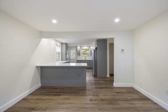 53 Kalish Ave, Enfield, CT 06082 - kitchen featuring freestanding refrigerator, a peninsula, light countertops, recessed lighting, and baseboards