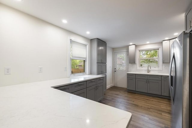 53 Kalish Ave, Enfield, CT 06082 - kitchen featuring freestanding refrigerator, a sink, gray cabinets, dark wood-type flooring, and recessed lighting