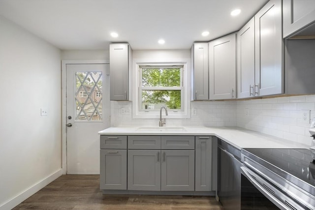 53 Kalish Ave, Enfield, CT 06082 - kitchen featuring appliances with stainless steel finishes, a sink, gray cabinetry, healthy amount of natural light, and recessed lighting