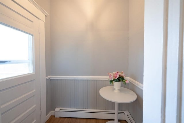 entryway featuring hardwood / wood-style floors and a baseboard radiator