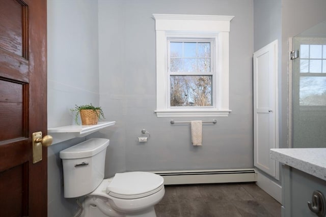 bathroom with vanity, a baseboard radiator, and toilet