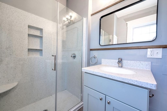 bathroom featuring vanity and walk in shower