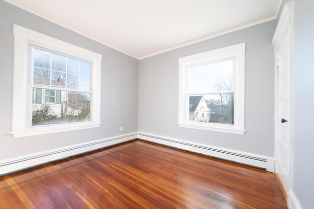 empty room featuring a baseboard radiator, hardwood / wood-style flooring, and ornamental molding